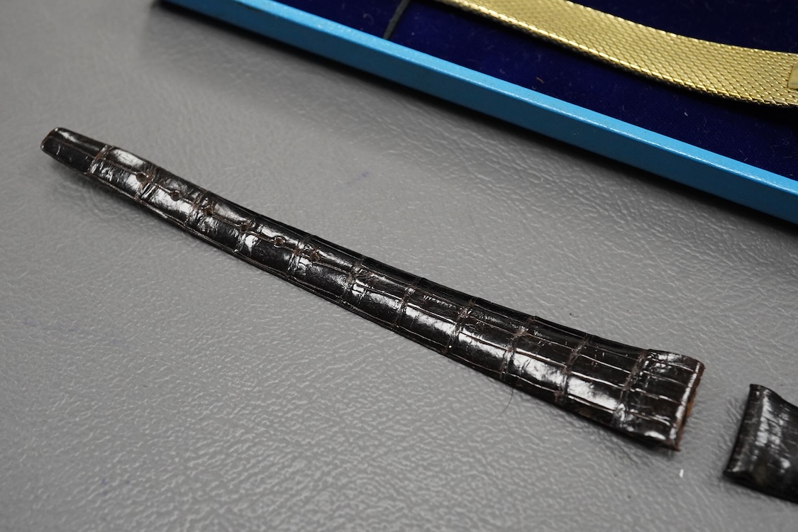 A gentleman's 18ct Girard-Perregaux manual wristwatch, oval brushed gilt dial with raised hour baton marks, seventeen jewels movement, signed, on an associated gilt metal articulated bracelet, in original case.